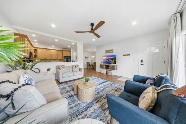 Open Living Space with Kitchen View and Cozy Seating