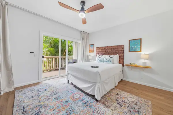 Queen Bedroom with Lanai Access and Coastal Decor