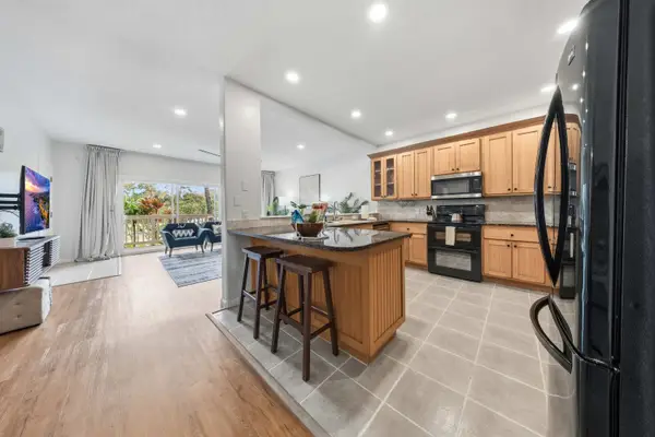 Kitchen with Wood Cabinets and Breakfast Bar Seating