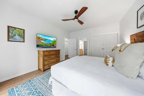 King Bedroom with TV, Dresser, and Ceiling Fan