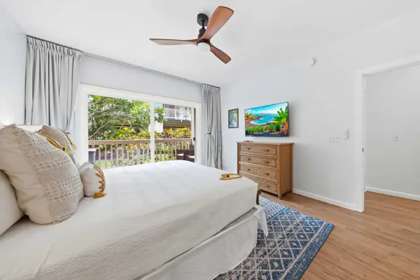 King Bedroom with Ceiling Fan and Balcony Access