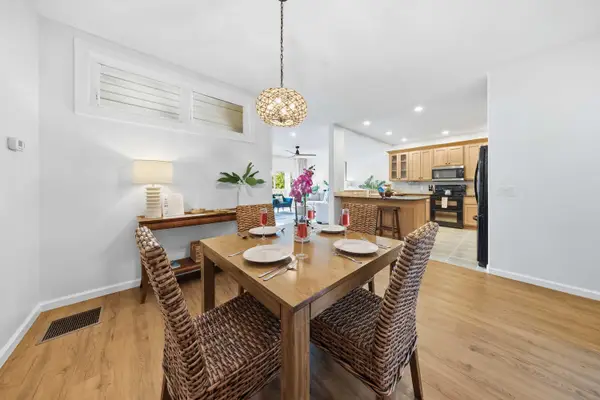 Dining Table for Six with Pendant Lighting and Kitchen View