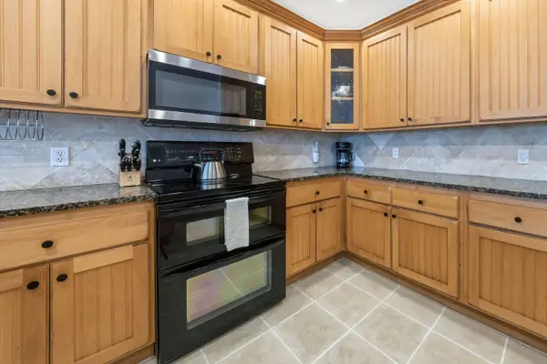 Well-Appointed Kitchen with Wood Cabinets and Double Oven
