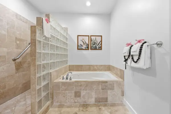 Soaking Tub with Glass Block Wall and Grab Bars