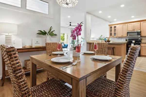 Wicker Dining Set with Table Setting Near the Kitchen