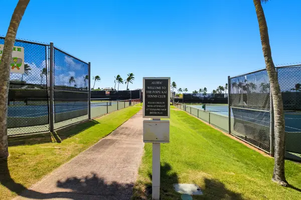 Palm-Lined Path to the Tennis Courts with Welcome Sign