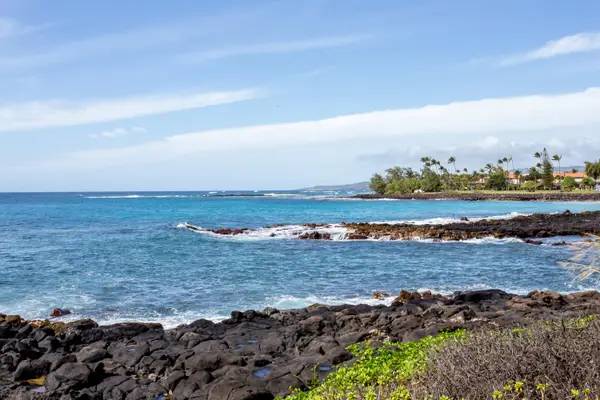 Lava Rock Coastline with Sandy Beach in the Distance