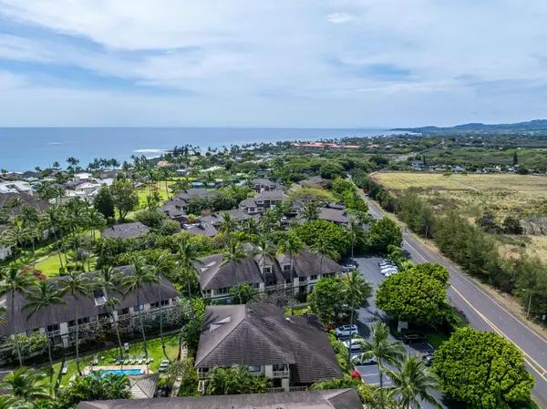 Aerial View of Estate Rooftops with Ocean Views Beyond