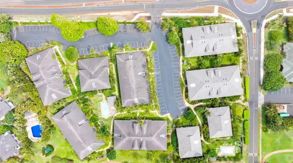 Aerial View of the Community with Rooftops and Pool