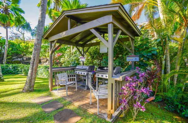 BBQ area near pool and hot tub