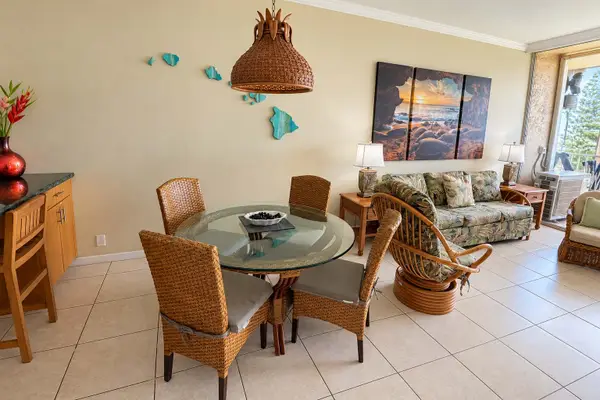 Open concept living/dining space with sleeper sofa for additional guests