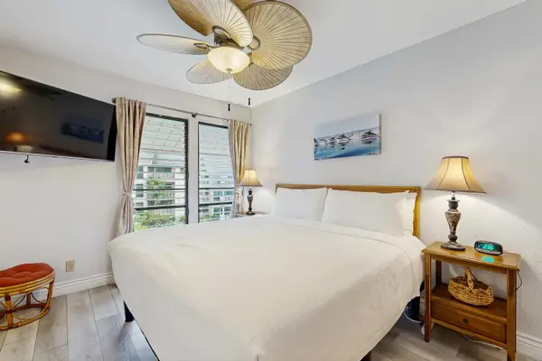 Tropical Retreat Primary Bedroom Featuring King Bed with Island-Style Accents and A/C
