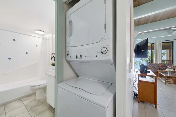 Laundry closet near full bathroom
