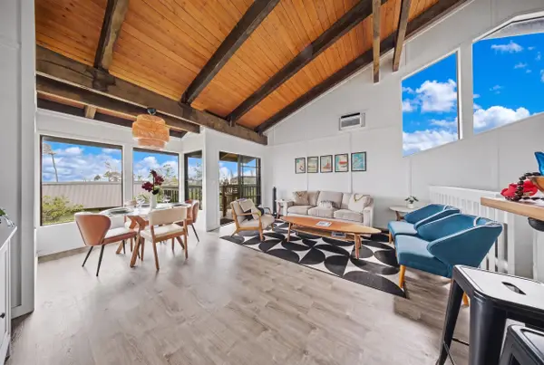 Open living and lounging area with lanai access