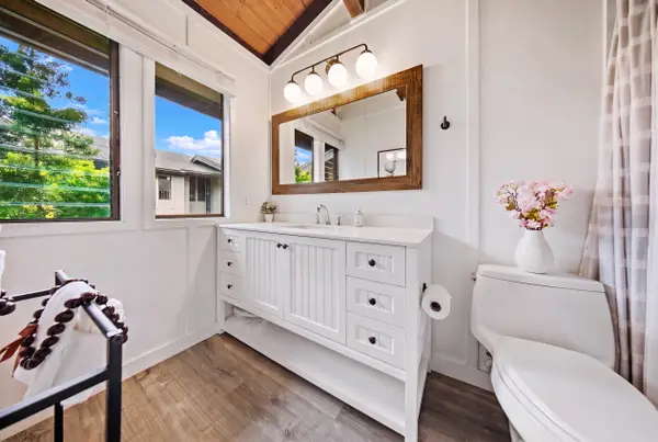Primary bathroom with bright vanity