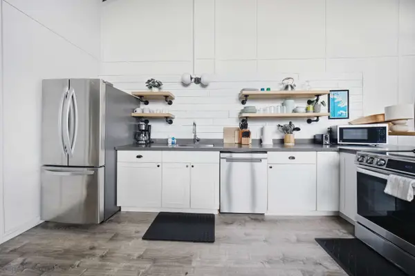 Open kitchen with stainless steel appliances