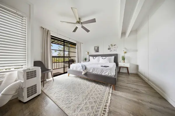 Primary bedroom with ceiling fan, AC and lanai access