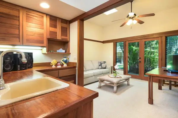 Open living space connects practical furnishings with a covered patio