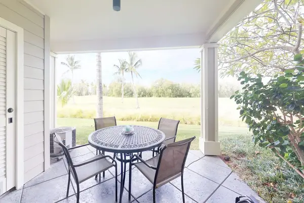 Covered lanai overlooking tropical greenery
