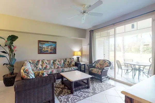 Bright living room with easy lanai access