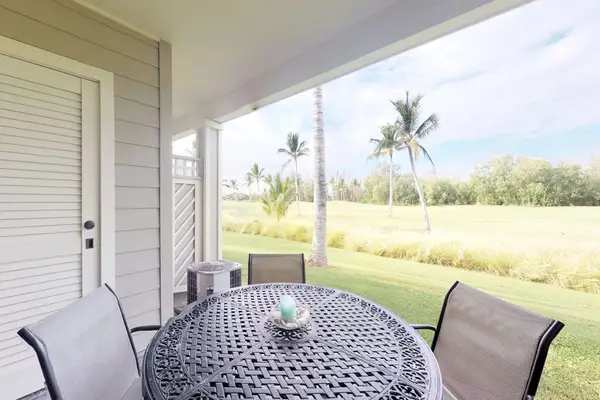 Covered lanai with peaceful garden views