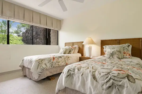 Sunlit Guest Bedroom Featuring Two Twin Beds & Large Window