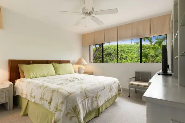 Cozy Bedroom Setup with Large Window & Peaceful Views