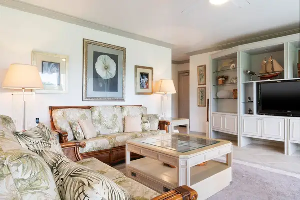 Relaxing Living Area with Flat-Screen TV & Large Coffee Table
