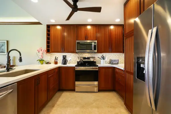 Fully stocked stainless steel kitchen.