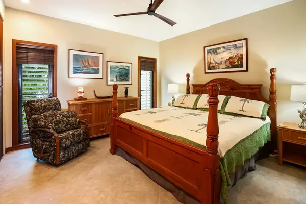 Master bedroom with king bed and an en-suite bathroom.
