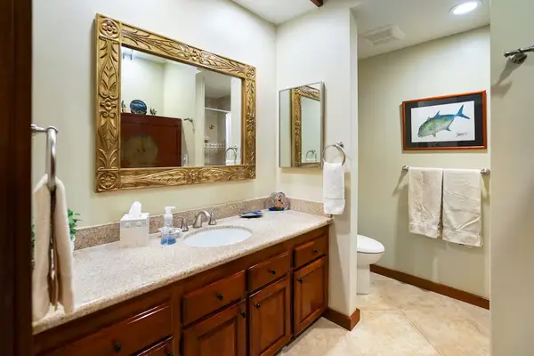 Master shower with double sinks and a large tiled walk-in shower.