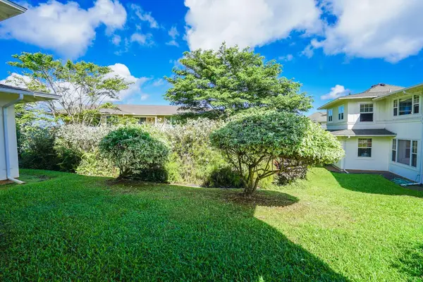 Lush Green Lawn & Well-Maintained Tropical Grounds