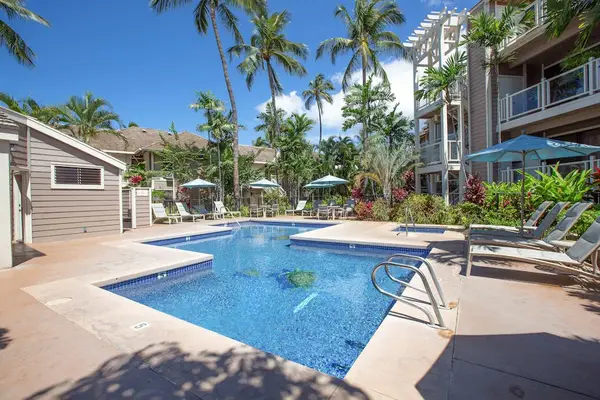 Refresh in the sparkling pool surrounded by tropical landscaping
