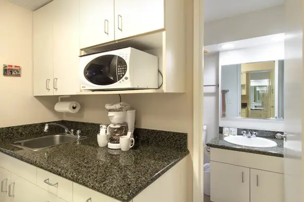Start your mornings with ease at this convenient coffee station, ready whenever you need a fresh cup.