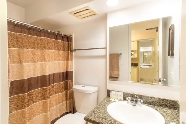 Enjoy the convenience of a full bathroom featuring both a refreshing shower and a relaxing tub.