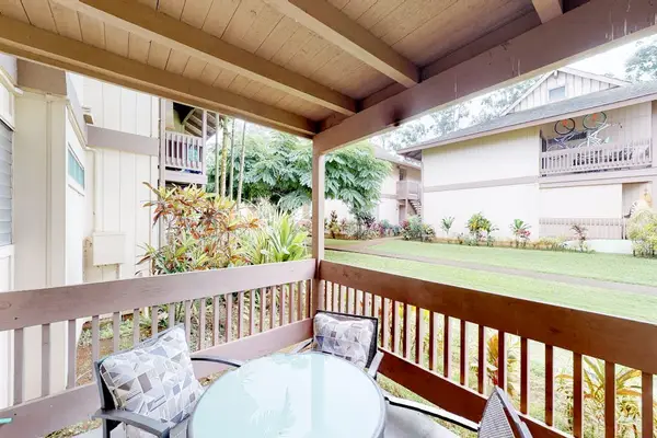 Covered lanai with comfortable seating to relax