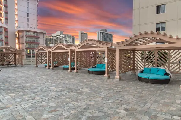 Unwind in the shared pool lounge area, offering a pleasant space to relax between swims.
