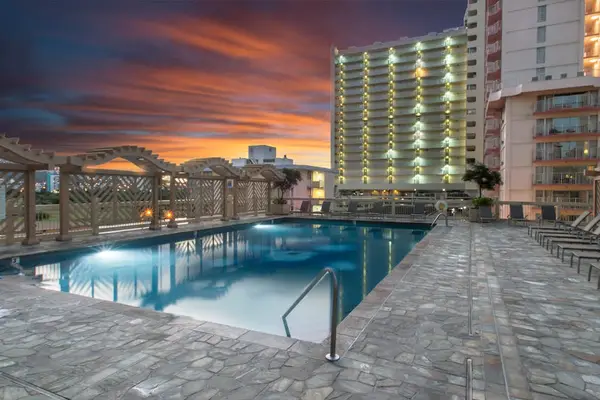 Take a refreshing dip in the communal swimming pool, perfect for unwinding after exploring Honolulu.
