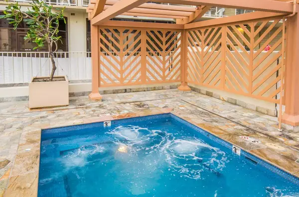 Relax in the shared jacuzzi, conveniently located near the common area pergola.