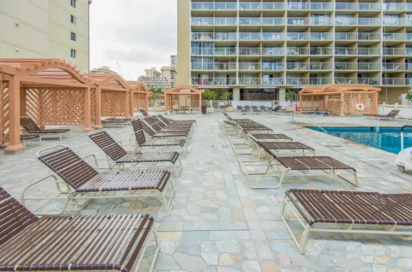 Soak up the Hawaiian sun in the comfortable lounge chairs lining the outdoor pool.