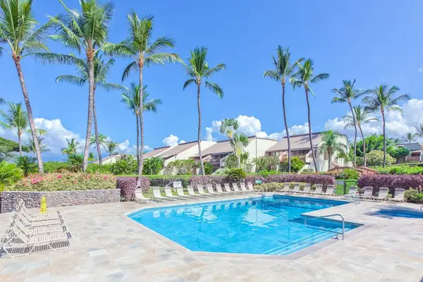Sunlit Outdoor Pool with Comfortable Lounge Chairs