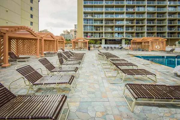 Relax beneath the sunshine on a spacious lounge deck made for easygoing resort days.