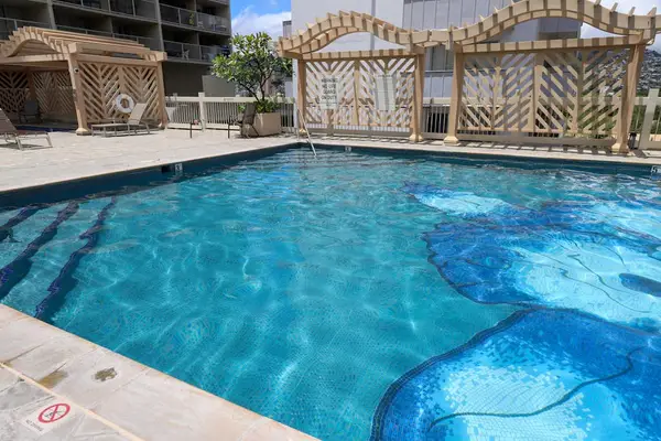 Escape to the crystal-clear resort pool for refreshing swims and relaxing sunny days.