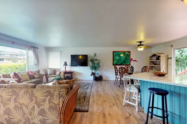 Barstools at the kitchen island for extra seating.