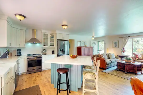 Large remodeled kitchen with island open to the living room