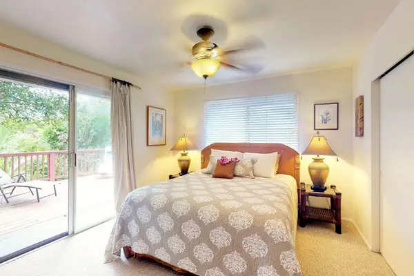 Master bedroom with king bed and lanai access.