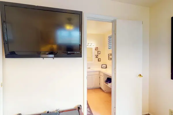 Master bedroom with flat screen tv.