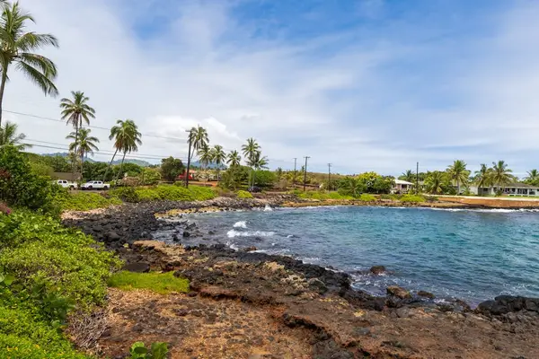 Rugged Lava Shoreline And Blue Waters