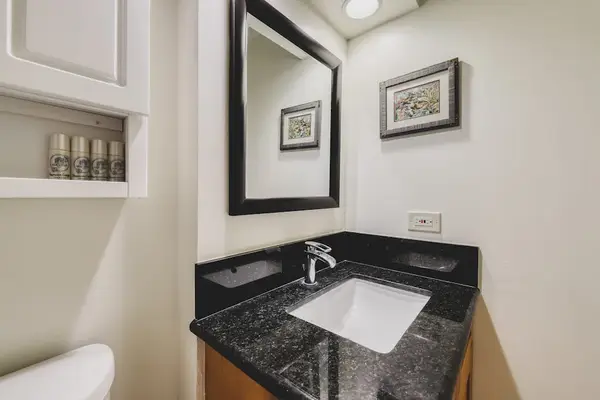 Freshen up with a sleek vanity and ample counter space.