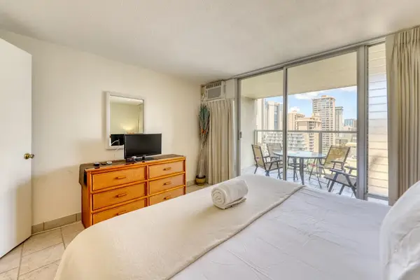 Wake up to beautiful Waikiki skyline views from the spacious king bedroom with direct access to your private lanai.